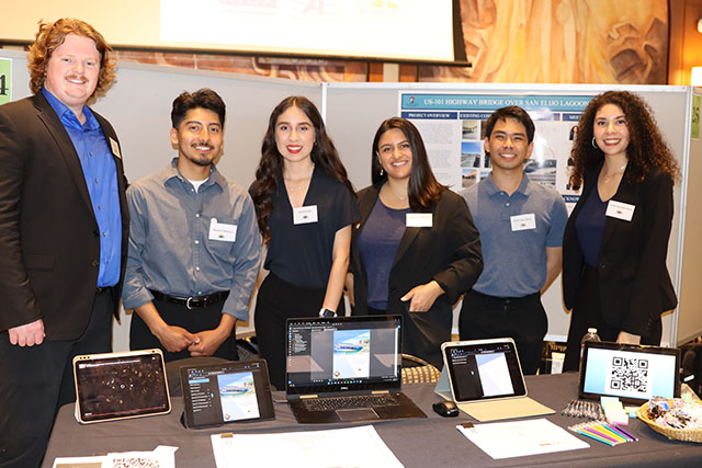 Five CCEE students at Design Day with their project sponsor